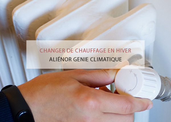 Personne réglant le thermostat d'un chauffage pour un confort optimal.